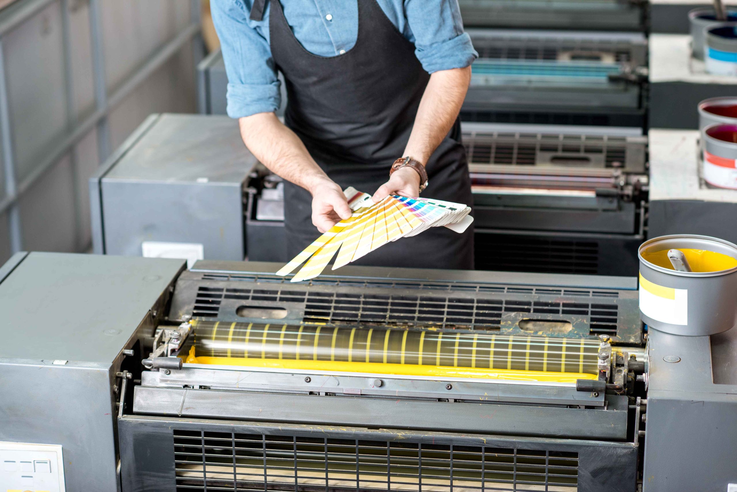 Man adjusting printing inks.
