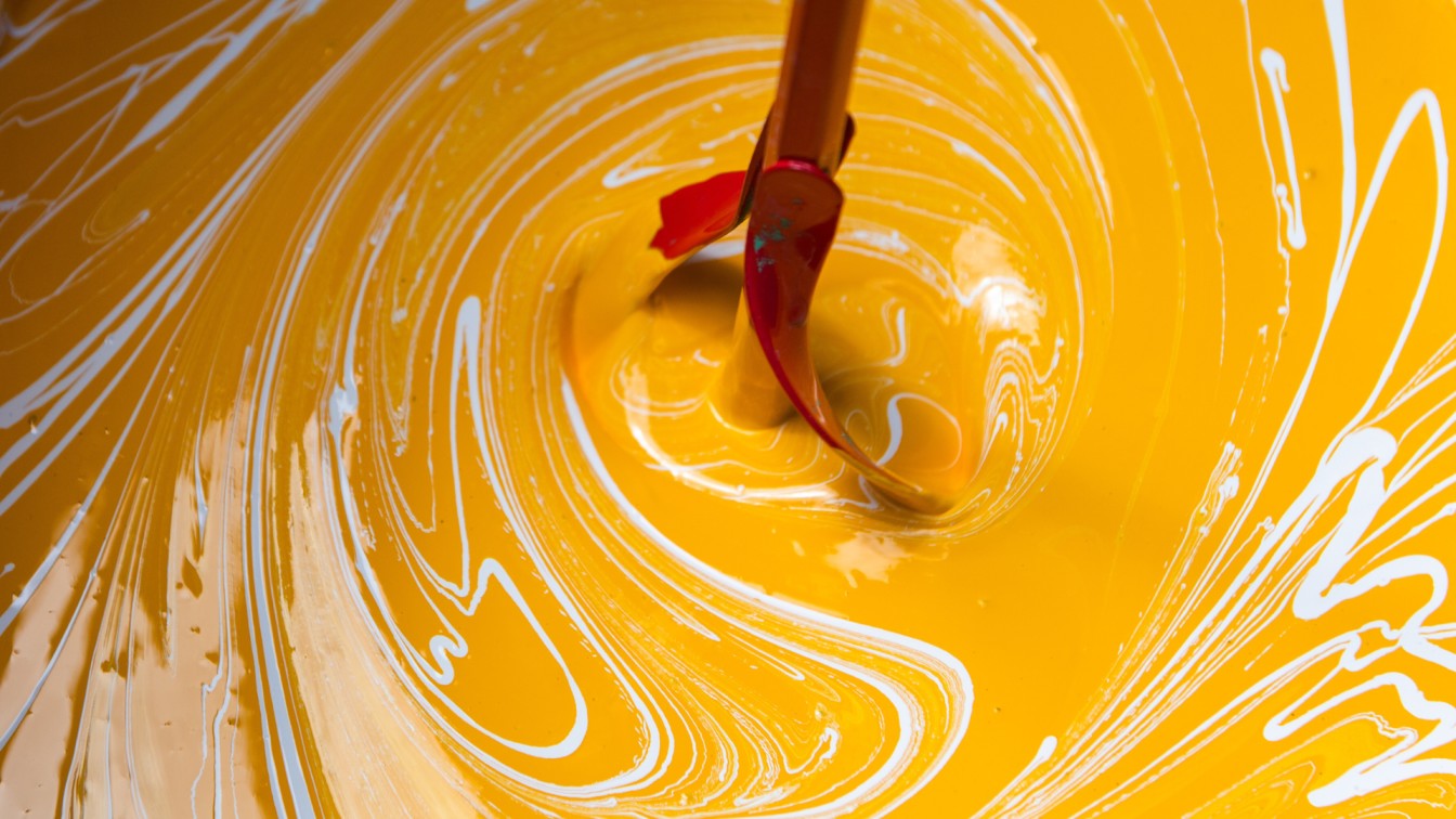 Close-up view of yellow coatings in the bucket from above