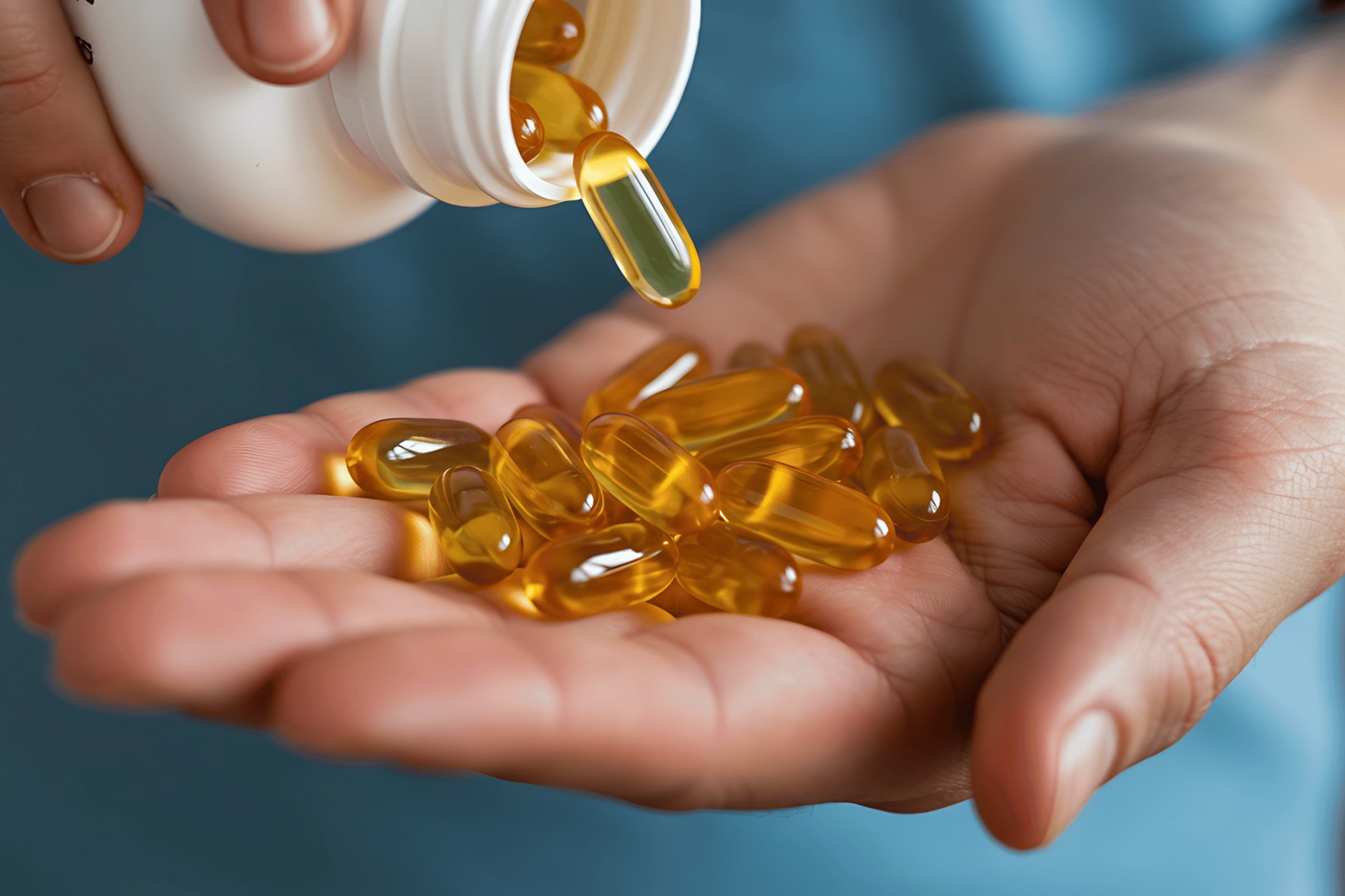 Woman picking softgel capsules