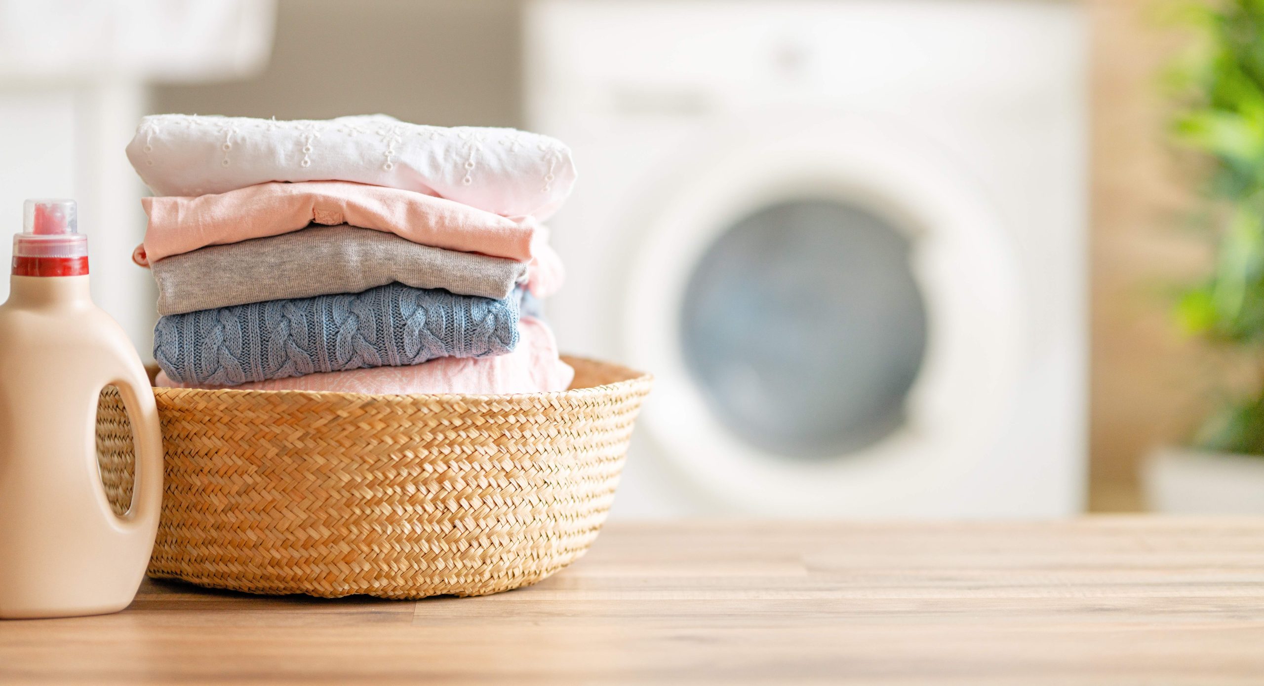 Interior of a real laundry room with a washing machine at home