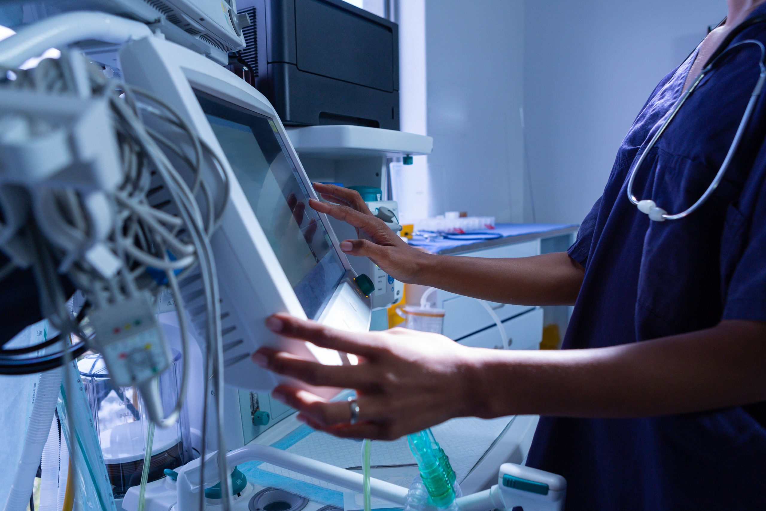 Surgeon using medical equipment in operating room of the hospita