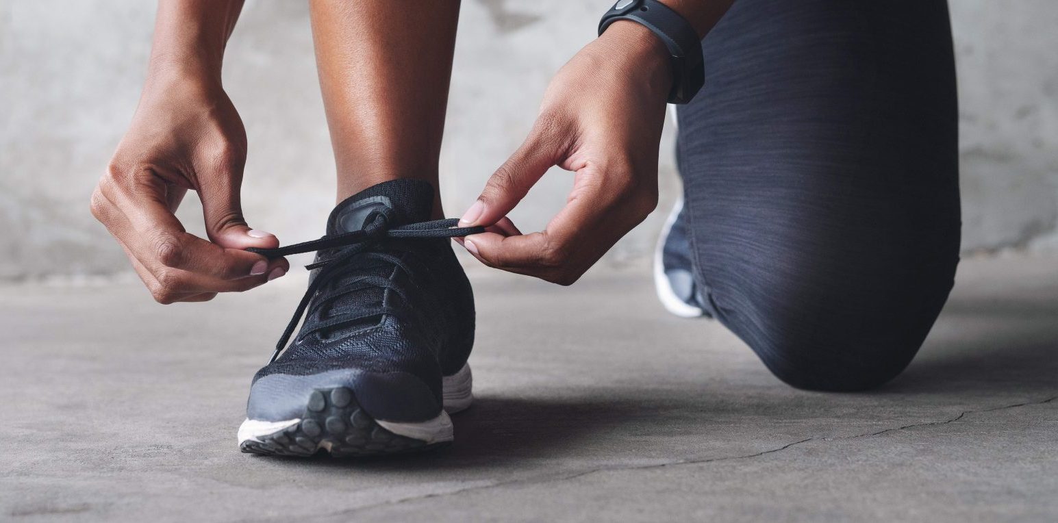Fitness, person and tie shoes on banner for athletic, sport or cardio outdoor for workout or exercise. Training, athlete and getting ready for wellness, healthy body or lifestyle on mockup space.