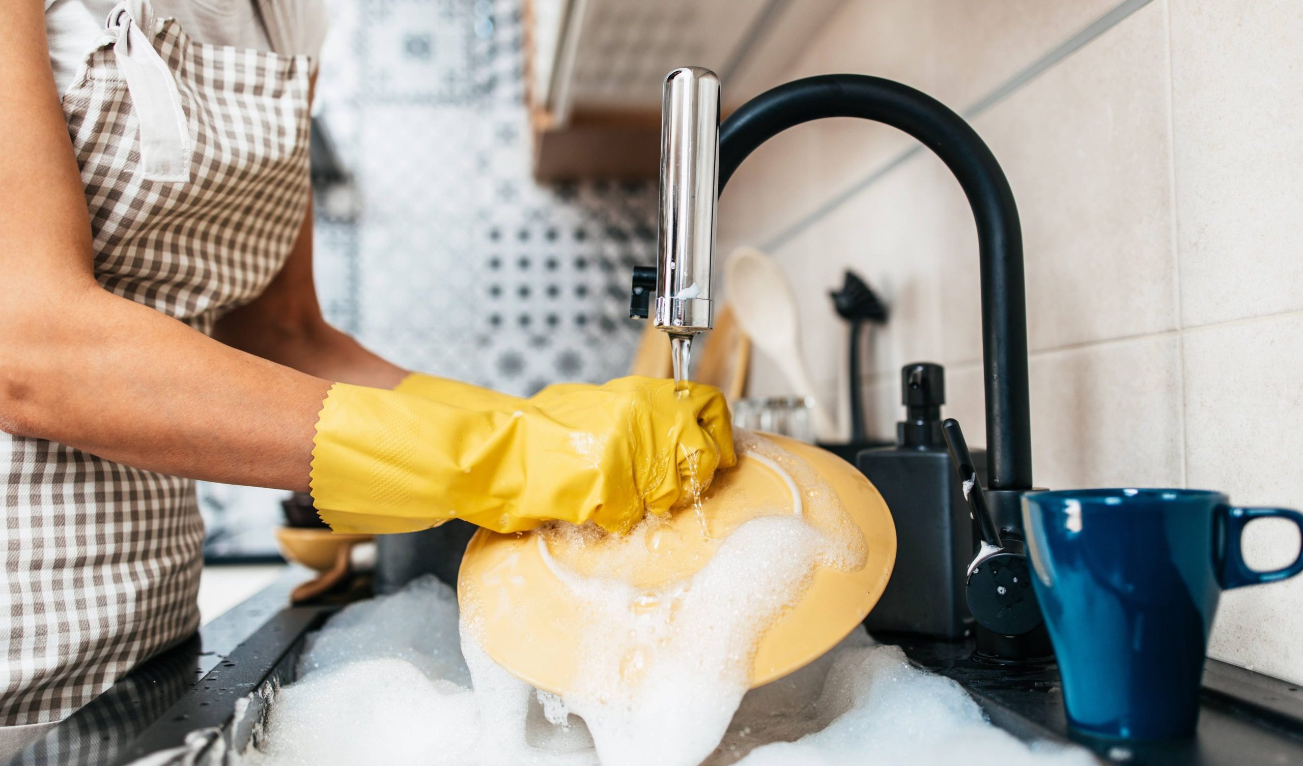 Woman washing the dishes.