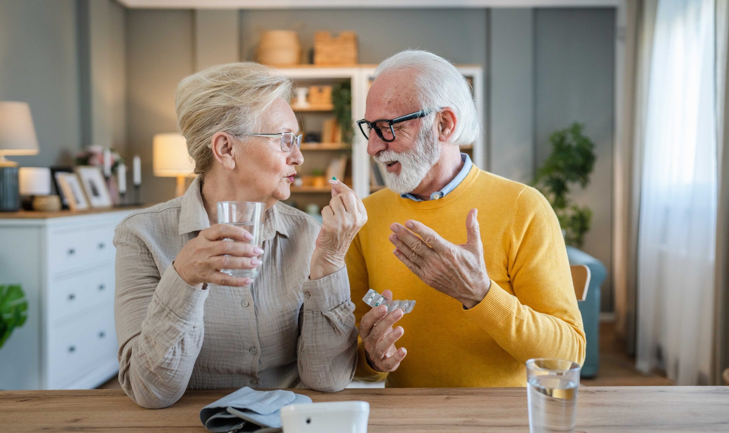 Older couple reviewing clinical nutrition products together at home.