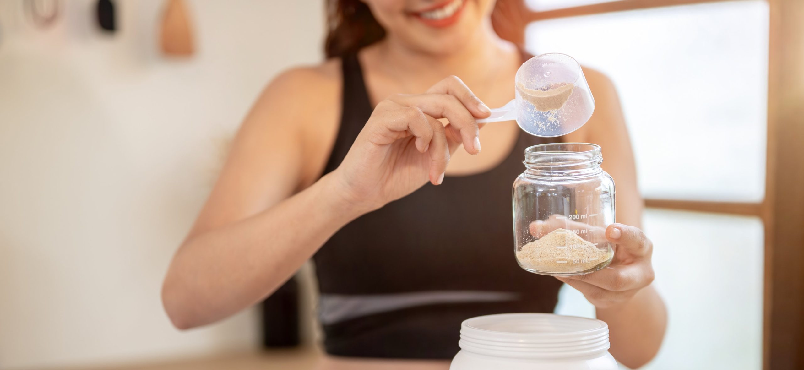 Woman preparing sport shake.